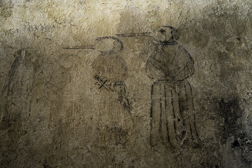 A medieval drawing of a plague doctor