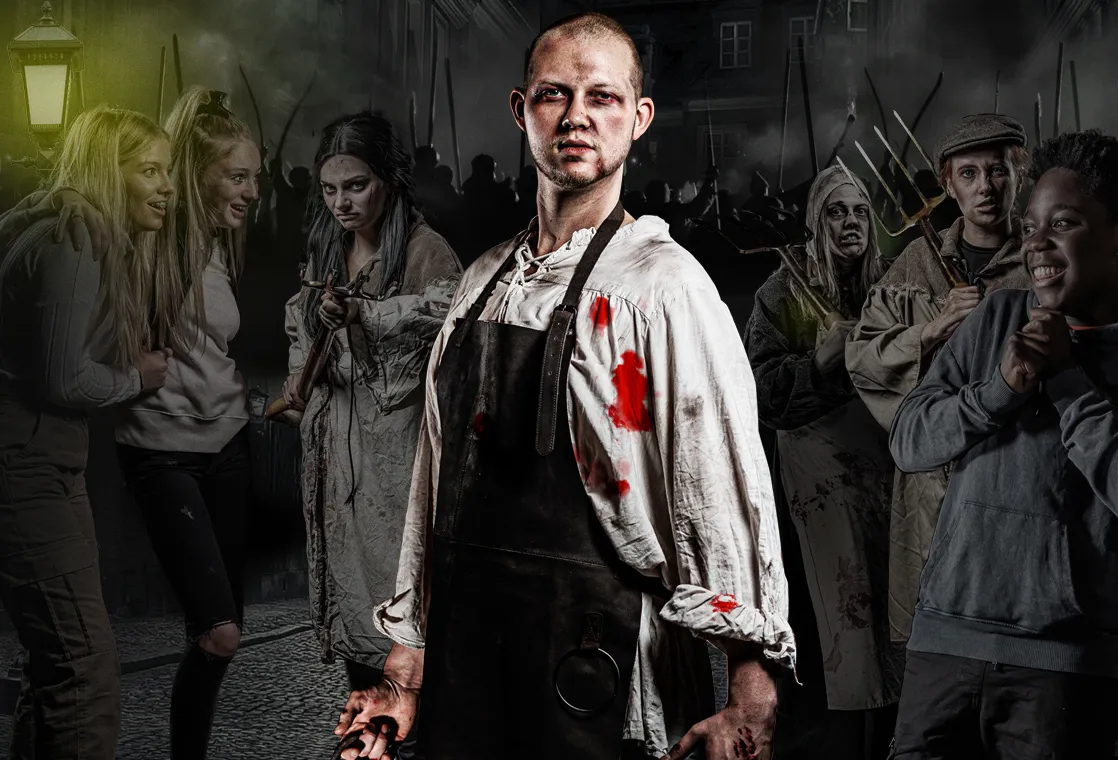Scary butcher with blood standing on the streets of Hamburg. Angry rioters behind him. 